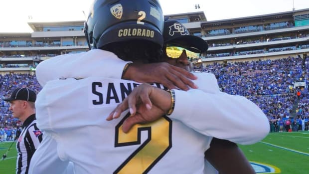 Deion Sanders hugging Shedeur Sanders at Rose Bowl on Oct. 28